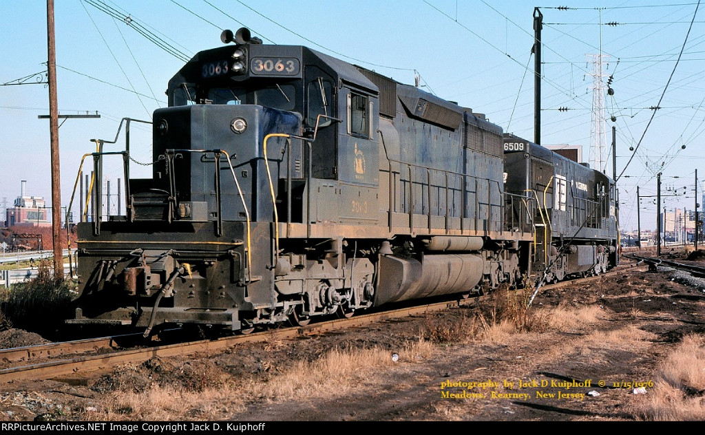 CNJ, Central of New Jersey SD40 3063, PC Penn Central U25C 6509 at the Meadows, Kearny, New Jersey..  November 15, 1976.  